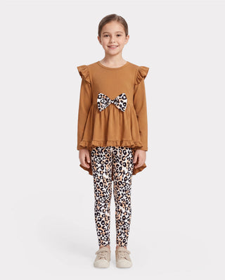 Two-piece kids outfit with a long-sleeve tee and printed trousers, the kind of everyday play clothing that takes the most stains