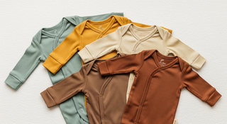 Gender neutral bamboo baby sleepers in earth tones for minimalist parents