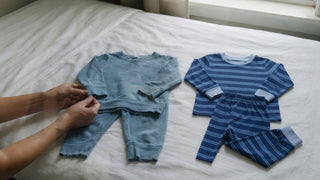Year-old and nearly new bamboo kids' pyjamas laid side by side for comparison