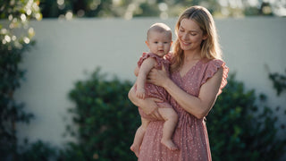 Mother and daughter wearing matching dresses