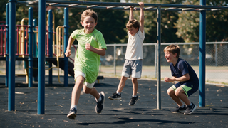 Kids in playground-ready activewear running and climbing at recess — breathable quick-dry tees and shorts for PE and outdoor play