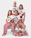 Conjunto de pijama familiar navideño a juego con Papá Noel y copos de nieve, rayas rojas, pijama rojo