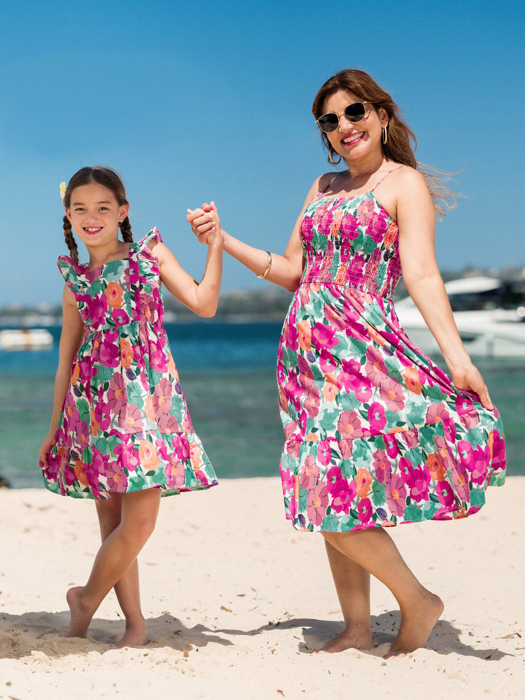 Plus-size mom and daughter in matching multi-color smocked floral vacation dresses with ruffle straps - Mother's Day picnic outfit from Patpat