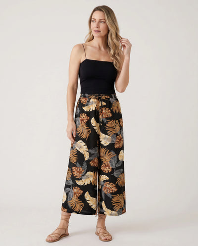 Familiäres Set aus passendem Strandkleid mit Blumendruck Kurzärmeliges Hemd oder Hemdchen und Hosen mit weitem Bein für den Sommerurlaub Familienlooks Schwarz+Weiß
