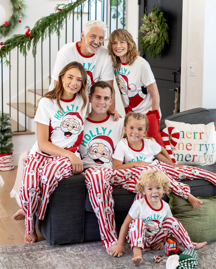 Conjunto de pijama familiar navideño a juego con Papá Noel y copos de nieve, rayas rojas, pijama rojo