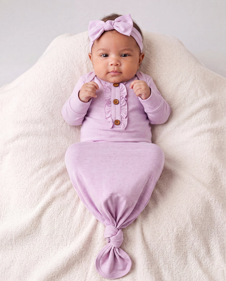 Gigoteuse en laine pour bébé fille avec bandeau rose