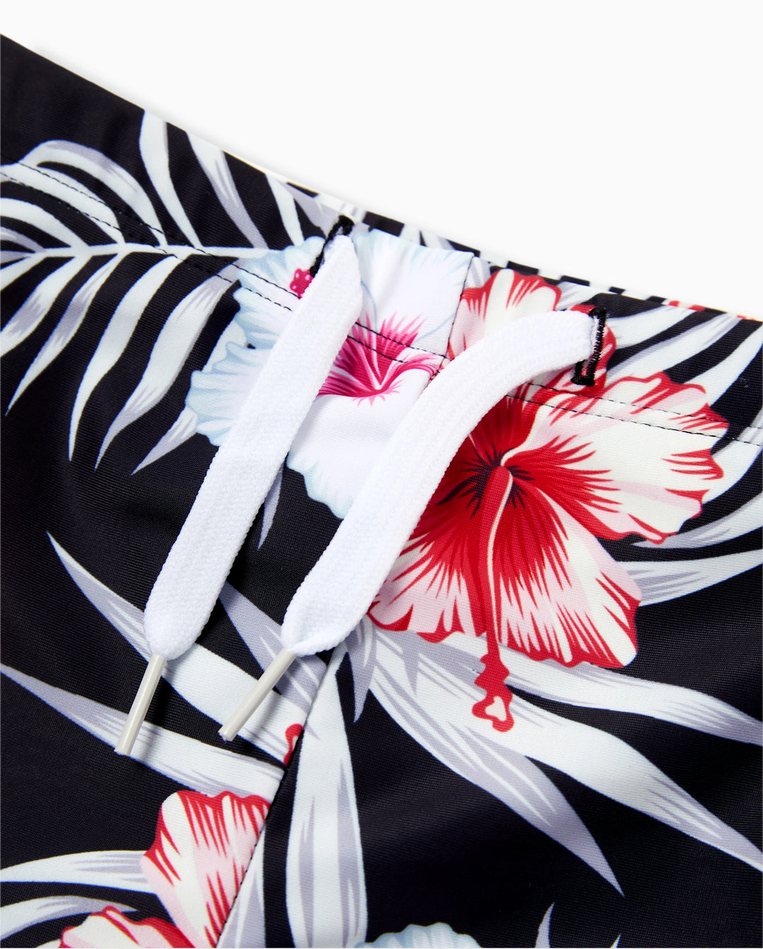 Bañador corto para niño pequeño con estampado floral tropical en negro