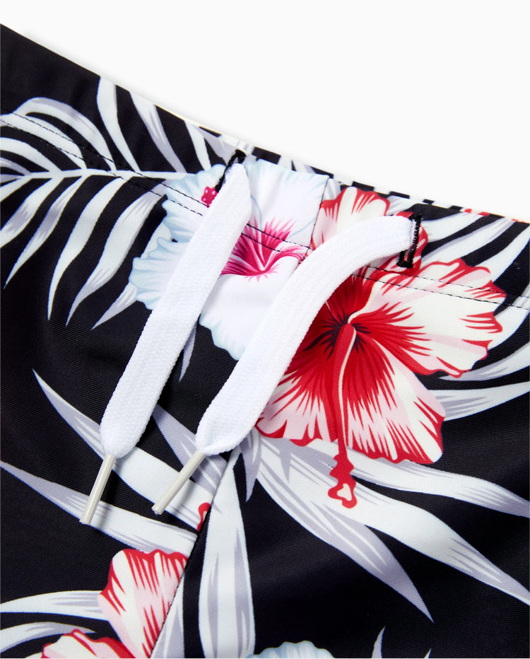 Bañador corto para niño pequeño con estampado floral tropical en negro