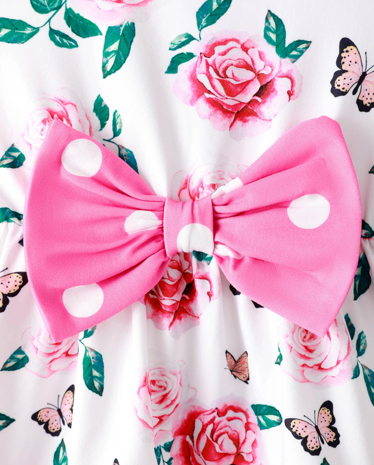 Conjunto de 2 piezas para niña pequeña con estampado floral, diseño de lazo, volantes, camiseta sin mangas de corte alto y pantalón de lunares, color rosa
