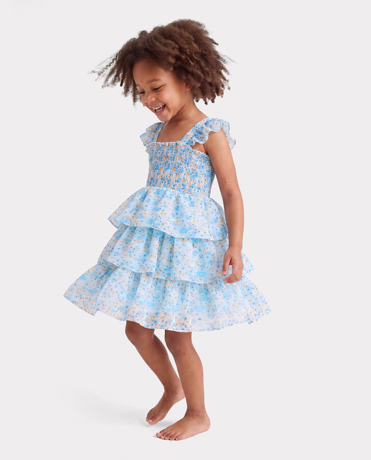 Vestido azul sin mangas con volantes y estampado floral para niña pequeña