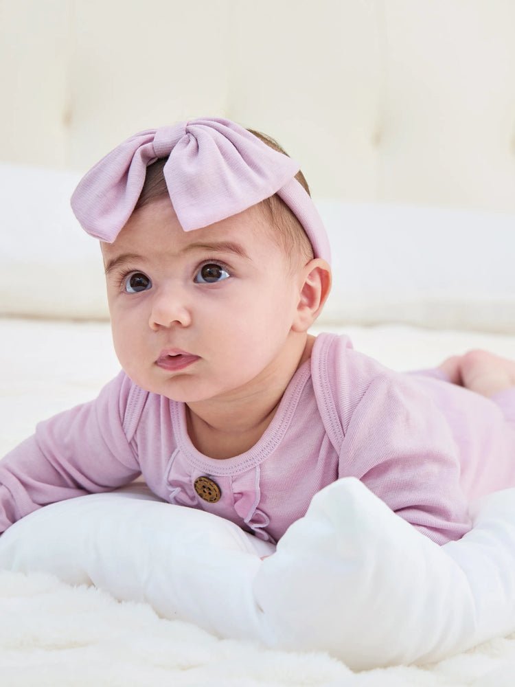 Gigoteuse en laine pour bébé fille avec bandeau rose