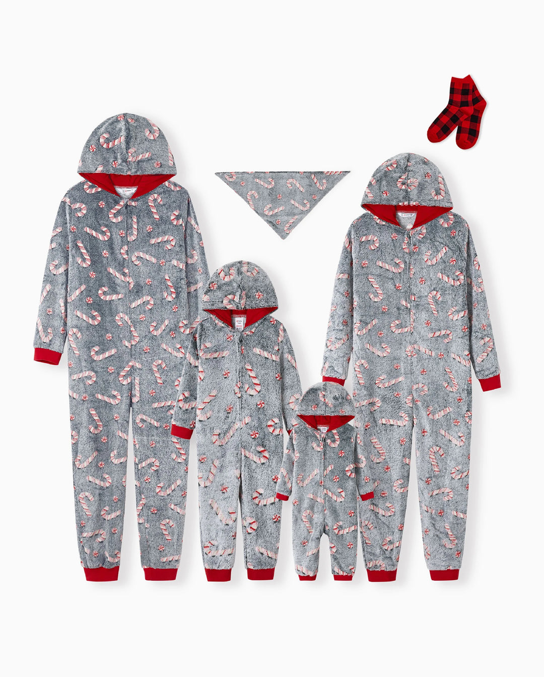 Pijamas de una pieza a juego con trajes navideños, estampado de bastón de caramelo (brillan en la oscuridad) y calcetines navideños negros.