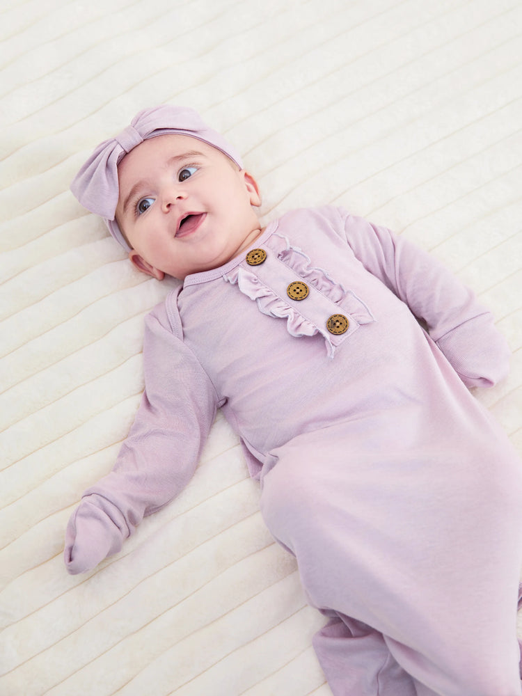 Gigoteuse en laine pour bébé fille avec bandeau rose