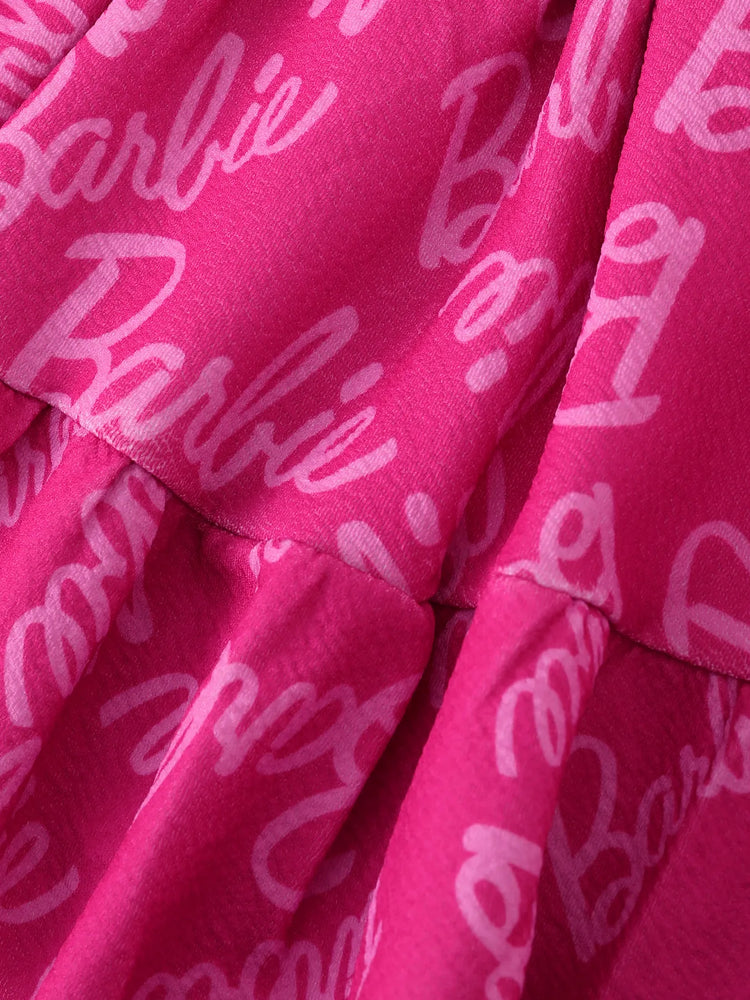 Conjunto de 2 piezas de Barbie para niña pequeña con top con mangas abullonadas y estampado del alfabeto y falda con estampado del logotipo Roseo
