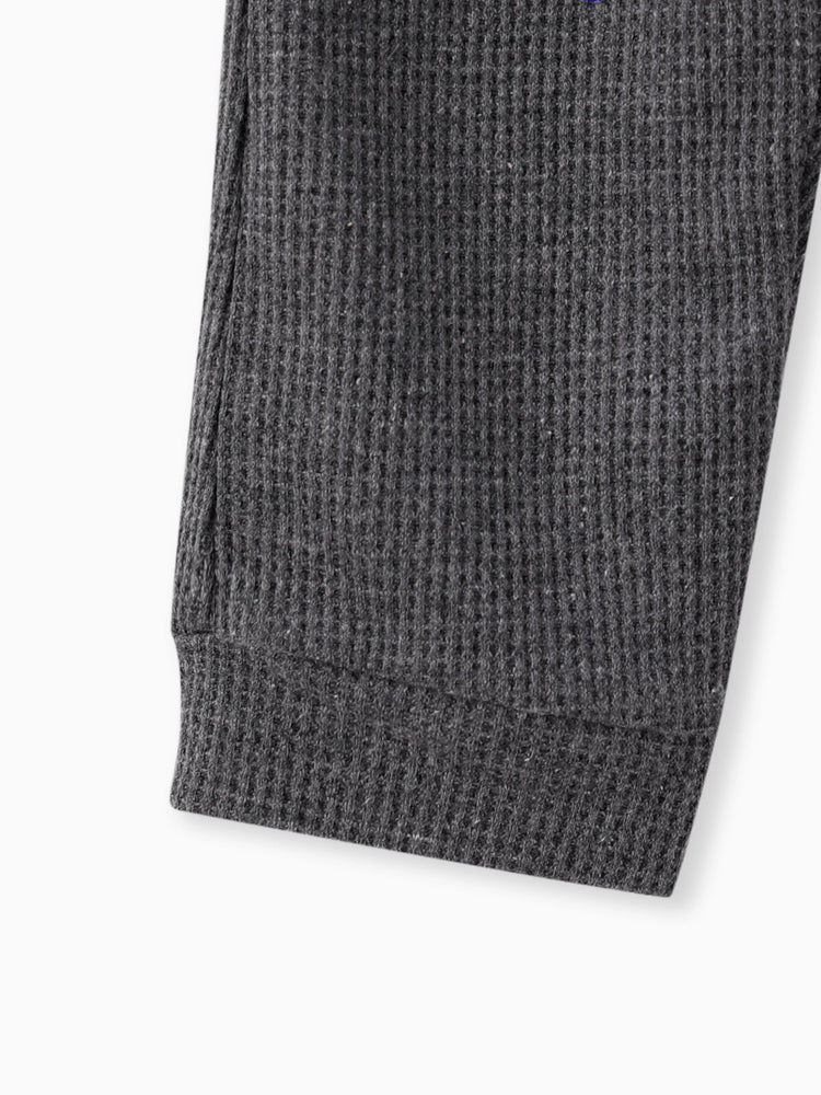 Salopette bébé garçon à imprimé gaufré et poches plaquées sur le devant, grise