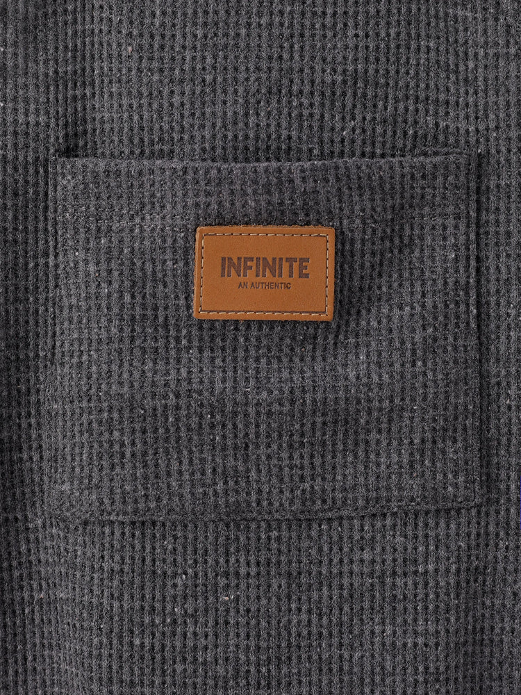 Salopette bébé garçon à imprimé gaufré et poches plaquées sur le devant, grise