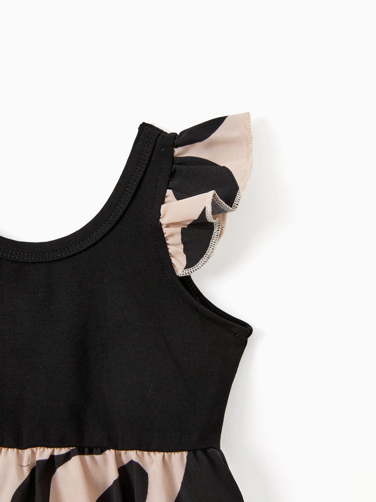 Ensembles assortis pour toute la famille : robe à bretelles florales croisées dans le dos et haut colorblock noir