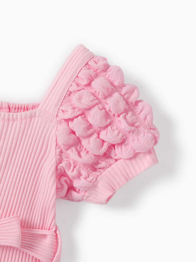 Combinaison bébé fille à manches bouffantes de couleur unie rose