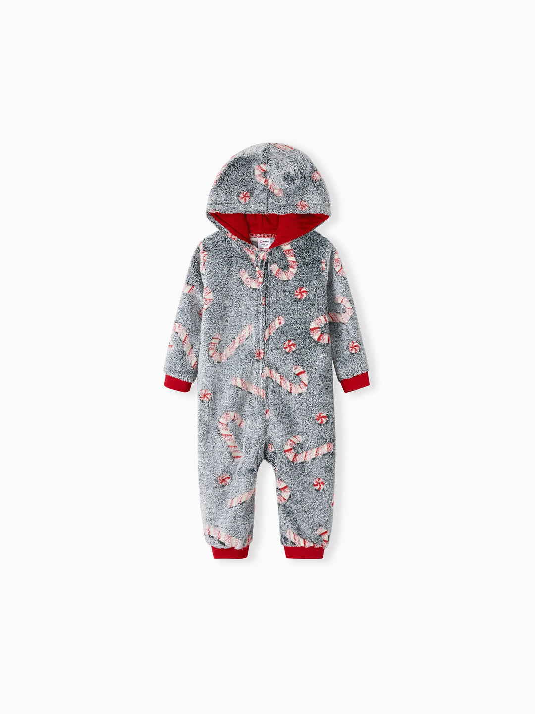 Pijamas de una pieza a juego con trajes navideños, estampado de bastón de caramelo (brillan en la oscuridad) y calcetines navideños negros.