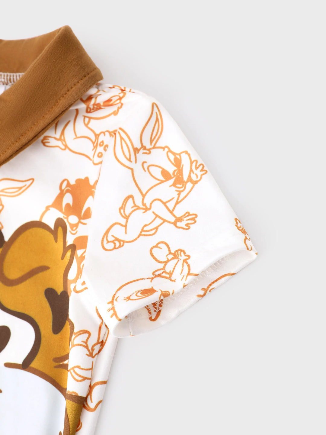Combinaison Looney Tunes pour bébé garçon, marron, à imprimé coutures et col polo colorblock.