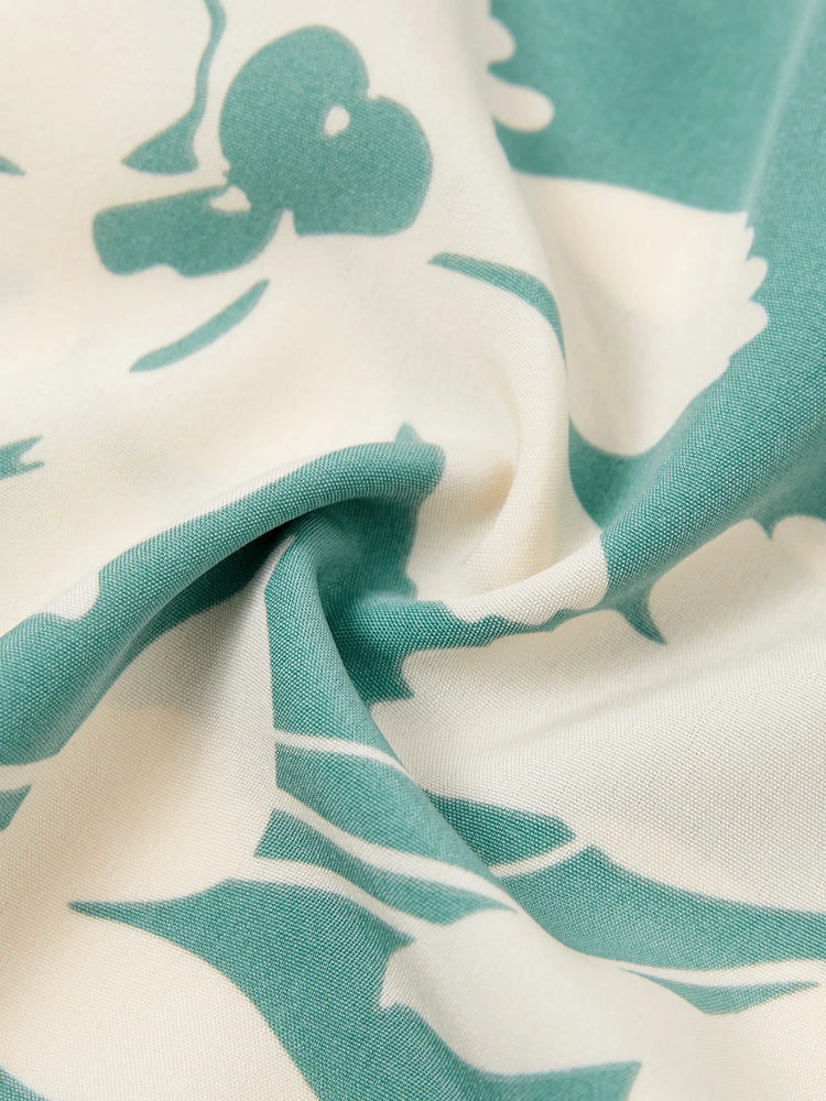 Ensemble familial assorti avec chemise à manches courtes ou robe froncée à imprimé feuilles vertes