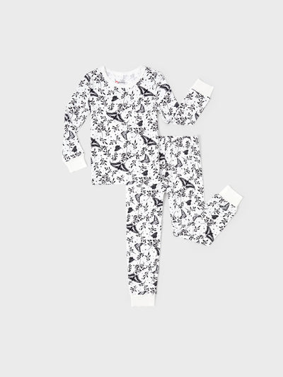 Snug-fitting two-piece bamboo pajamas with childlike animal print, white, baby/toddler.