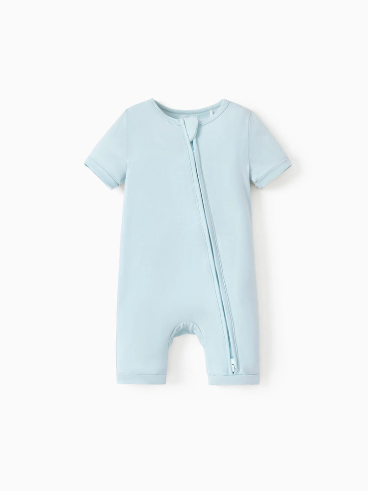 Baby snug-fitting bamboo footed onesie with two-way zipper and anti-slip grips, turquoise.