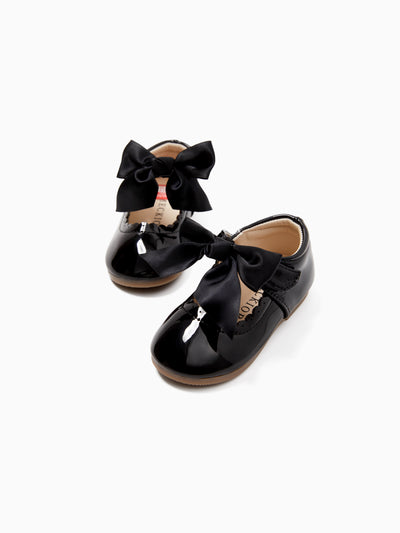 Chaussures de princesse blanches et noires pour tout-petits et enfants, avec nœud et ruban à bords ondulés