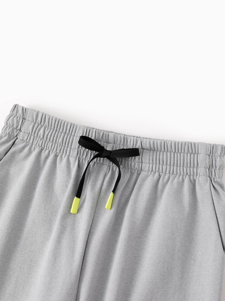 Pantalon de jogging pour enfant avec taille élastique et cordon de serrage – Pantalon de survêtement confortable avec poches pour garçons et filles, gris clair