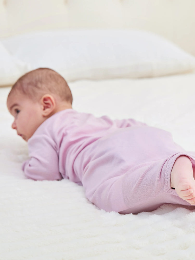 Gigoteuse en laine pour bébé fille avec bandeau rose