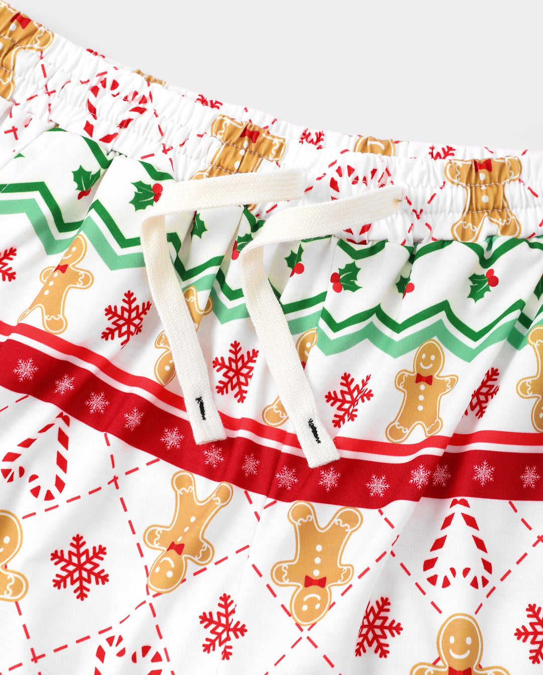Weihnachtliche passende Familienpyjamas mit Lebkuchenmotiv in Grün