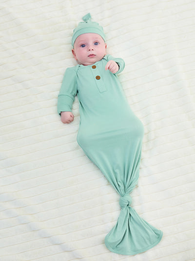 Bamboo infant sleeping gown with matching hat, light green.
